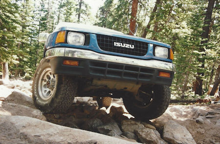 Keep the center of the vehicle high above the rocks.